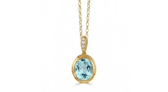 a yellow gold pendant necklace featuring a blue gemstone