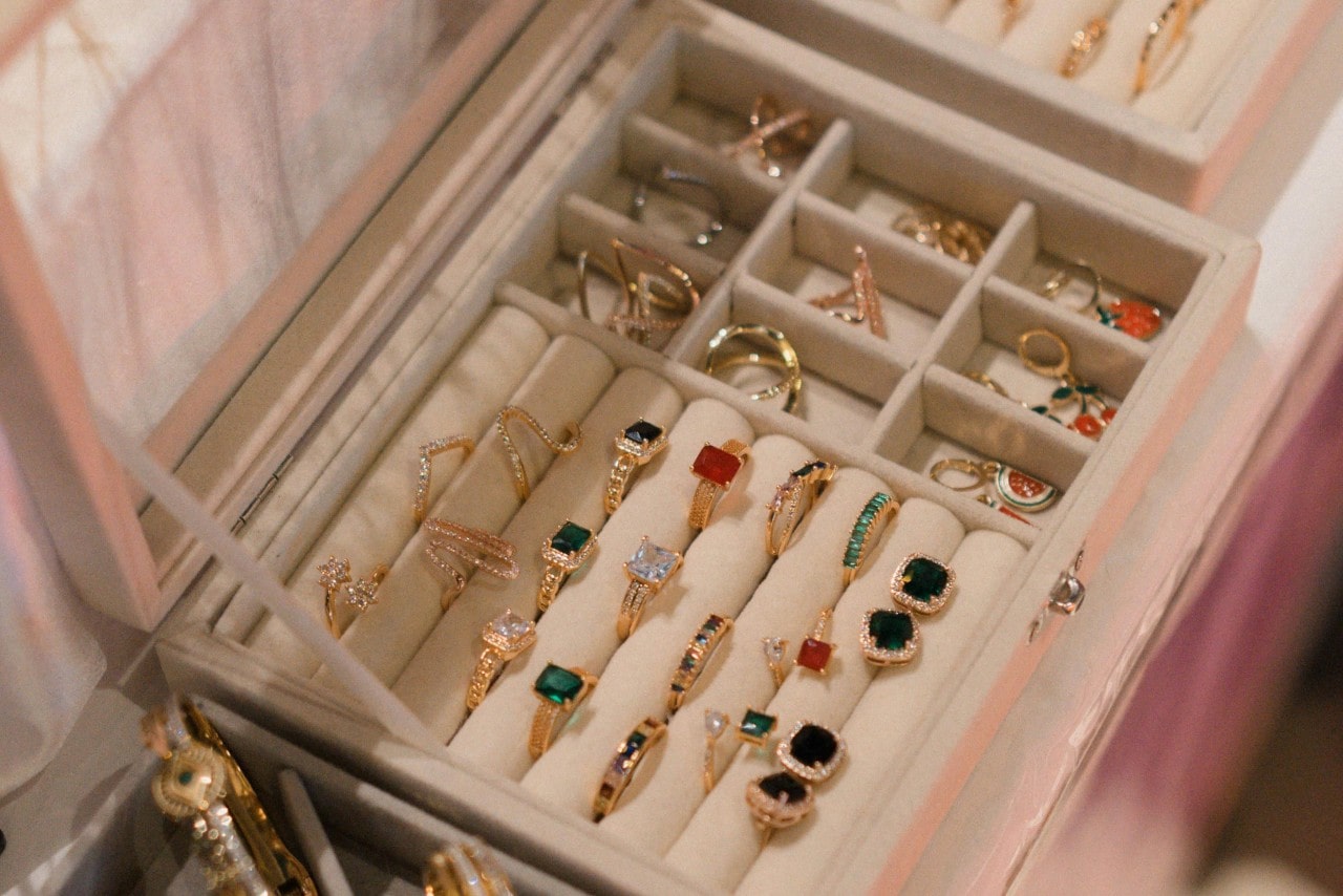 a jewelry box loaded up with rings and earrings a jewelry box loaded up with rings and earrings