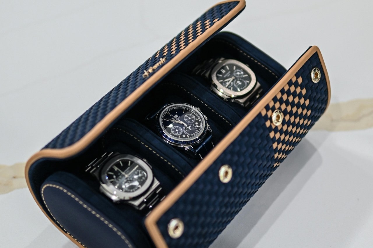 a travel watch case holding three luxury watches a travel watch case holding three luxury watches