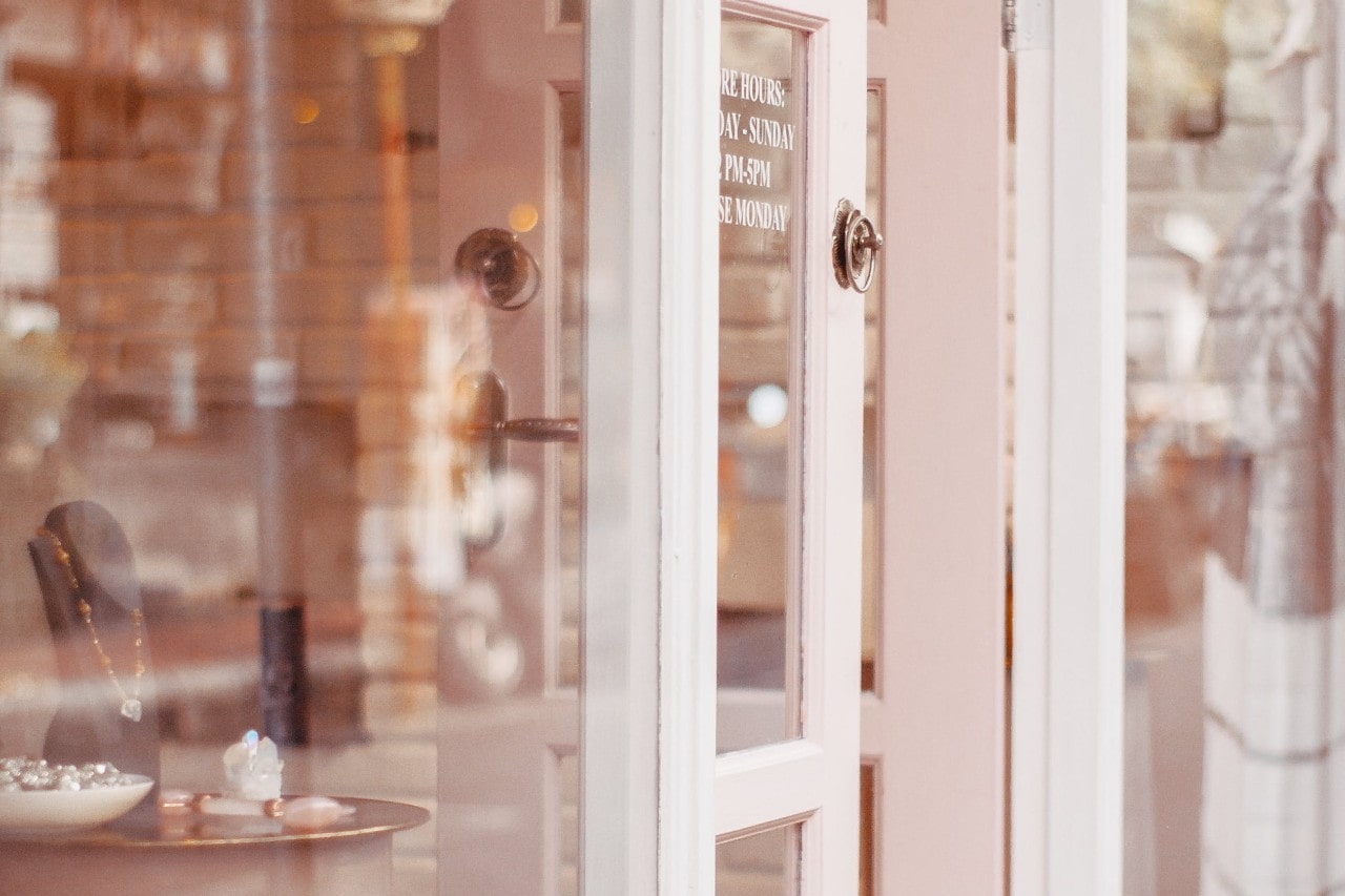 the outside view of a jewellery store as the sun rises.